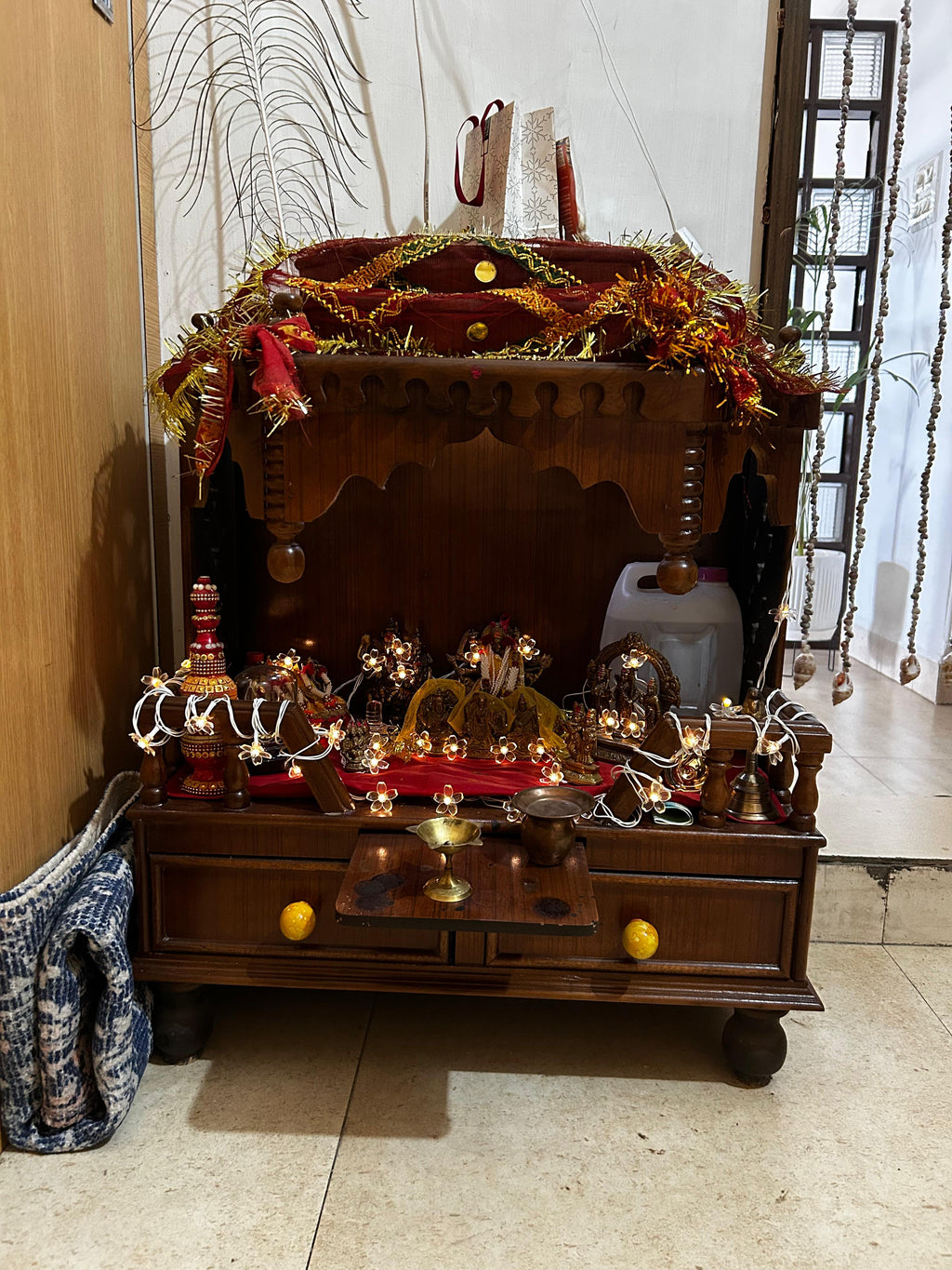Wooden altar with religious items in a home setting