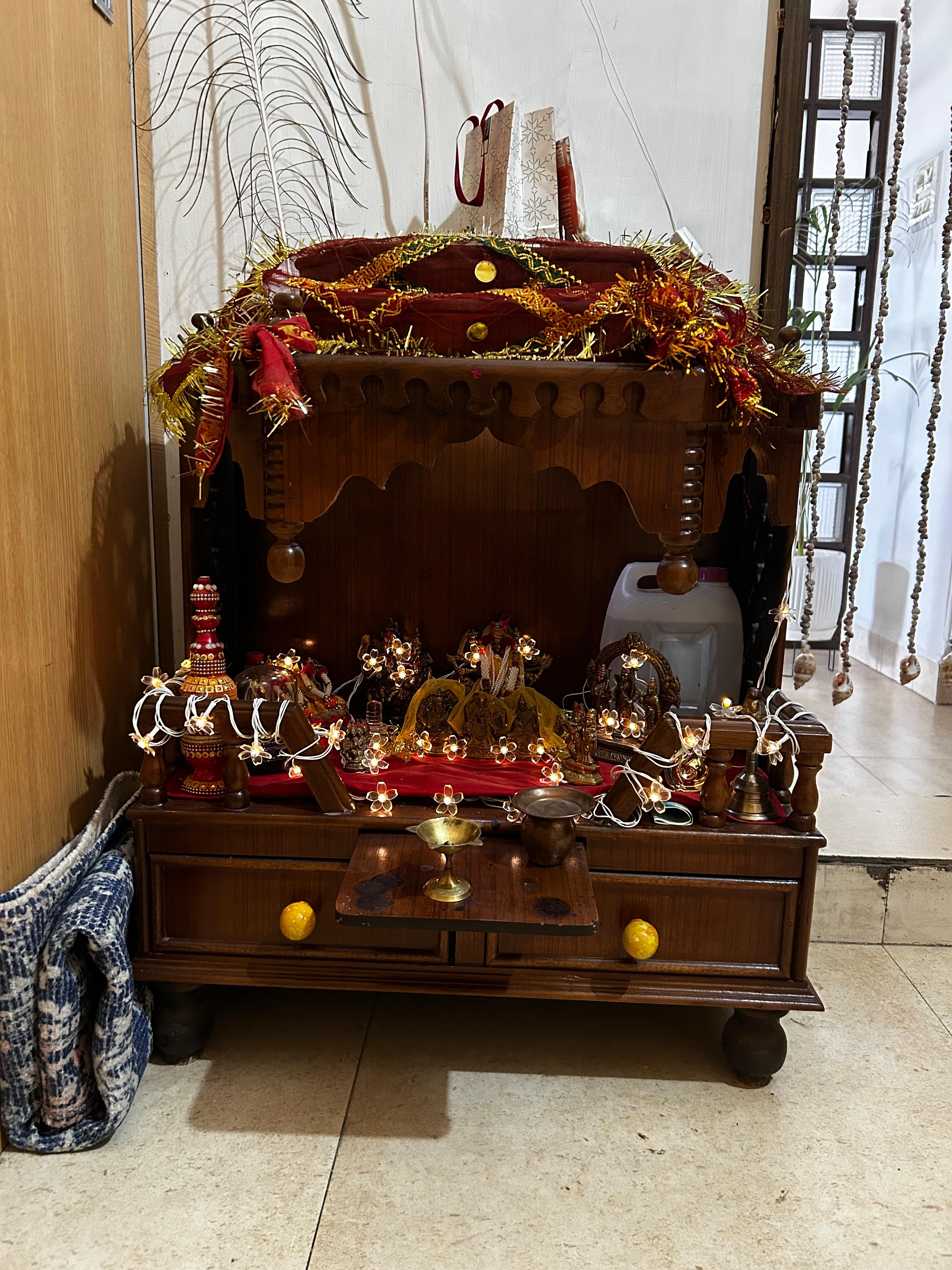 Wooden altar with religious items in a home setting